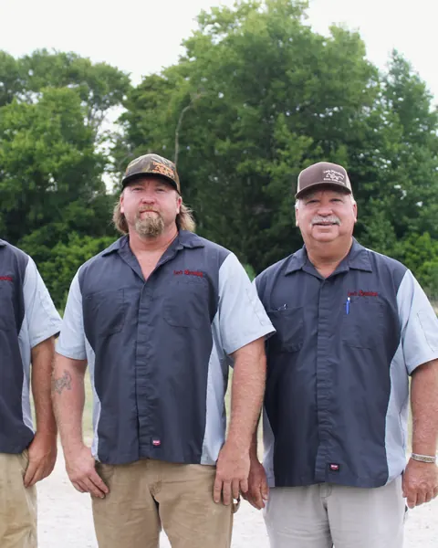 Three-man crew in Lee's Plumbing uniforms, from Lee's Plumbing’s own photographs.