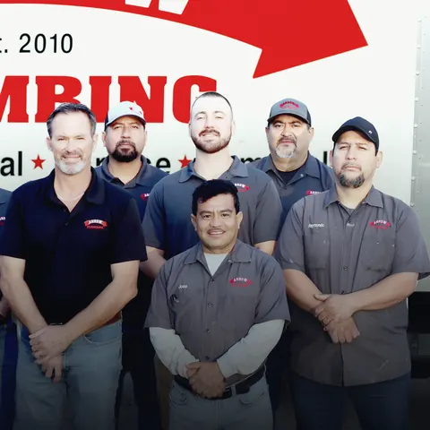 Crew group photo with branded truck (about page banner), from Arrow Plumbing’s own photographs.
