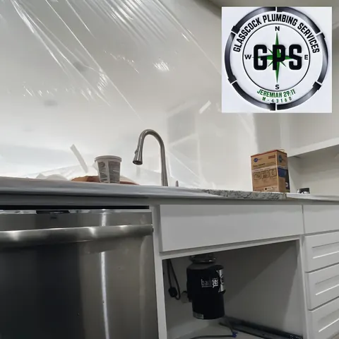 Under-sink install (company GPS logo overlaid by the site, not a stock watermark), from Glasscock Plumbing Services’s own photographs.