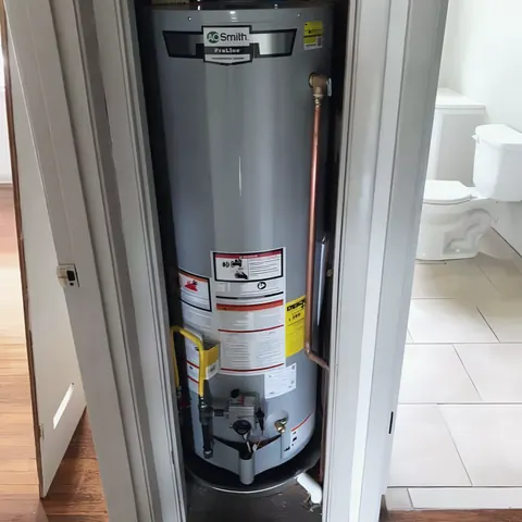 Gas water heater install in closet, from Glasscock Plumbing Services’s own photographs.