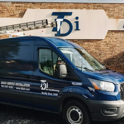 Branded TDi van at the office sign, from TDi Services’s own photographs.